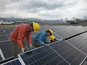 Climate Action Collaborative members work together in April 2022 to construct the Adam Palmer Solar Array in Gypsum.